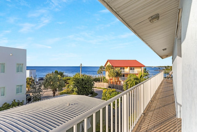 balcony featuring a water view