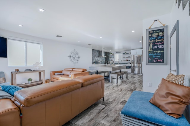 living room featuring plenty of natural light and light wood-type flooring