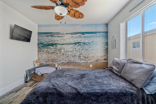 bedroom with hardwood / wood-style floors and ceiling fan