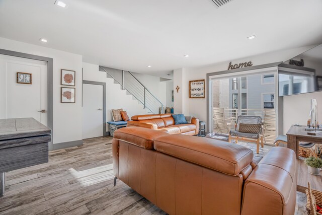 living room with light hardwood / wood-style floors