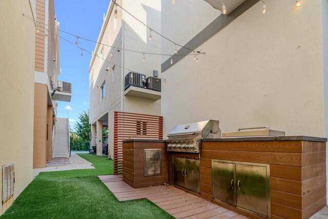 view of patio / terrace featuring grilling area and exterior kitchen