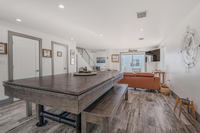 dining space with light hardwood / wood-style flooring