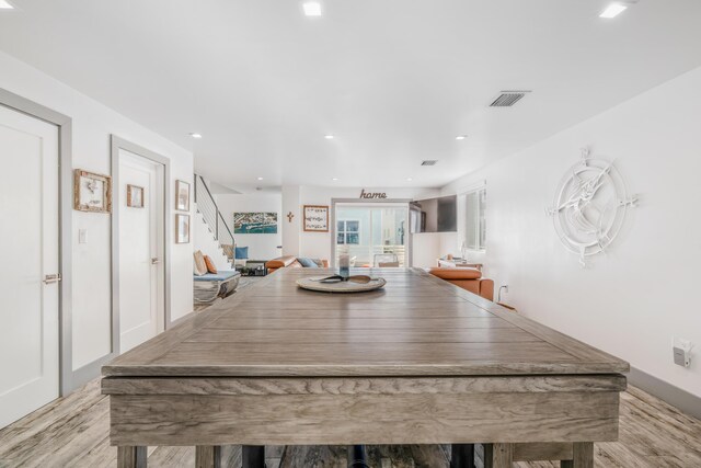 dining space featuring light wood-type flooring