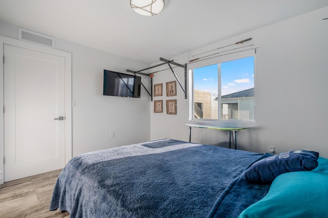 bedroom with light wood-type flooring