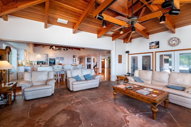 living room with high vaulted ceiling, wooden ceiling, a ceiling fan, french doors, and beam ceiling