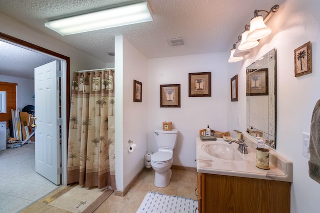 bathroom featuring visible vents, toilet, curtained shower, a textured ceiling, and vanity