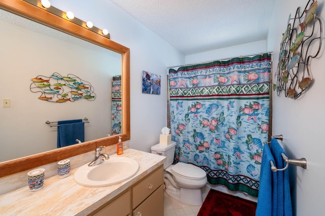 bathroom with curtained shower, toilet, vanity, a textured ceiling, and tile patterned flooring