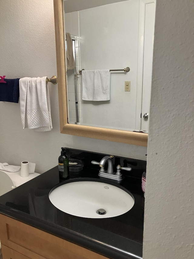 3930 S Roosevelt Blvd Unit N303, Key West, FL 33040 - bathroom featuring vanity and a shower with shower door