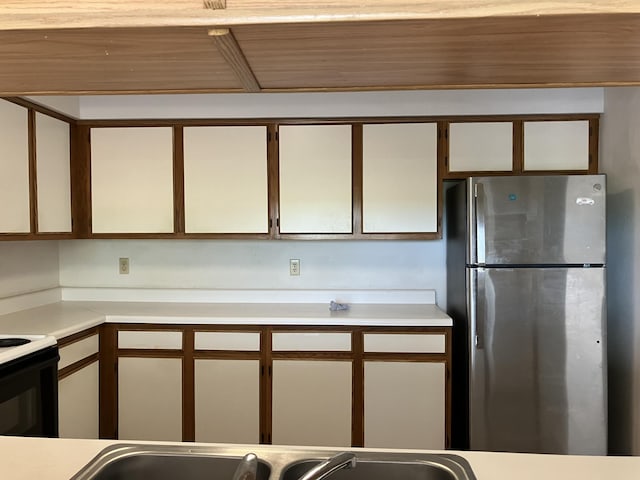 3930 S Roosevelt Blvd Unit N303, Key West, FL 33040 - kitchen with freestanding refrigerator, light countertops, electric range, and white cabinets