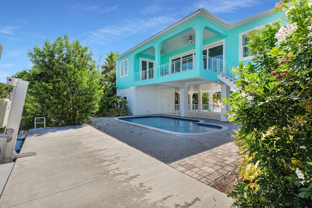 view of pool featuring ceiling fan and a patio