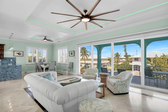 living room with crown molding and ceiling fan