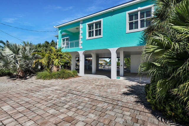 view of front of house featuring a balcony