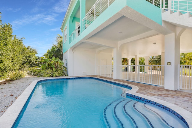 view of pool featuring a patio area