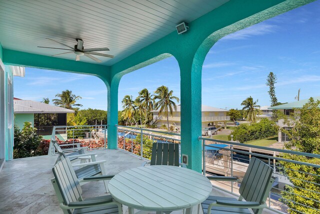 view of patio / terrace featuring ceiling fan and a balcony