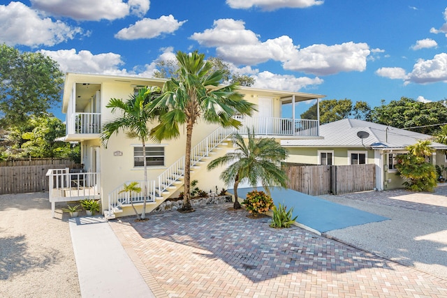 view of front of home with a balcony