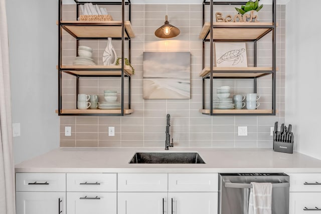 949 24th St, Ocean, Marathon, FL 33050 - kitchen with dishwasher, decorative backsplash, light countertops, and white cabinetry