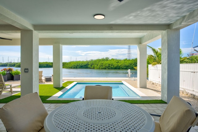 949 24th St, Ocean, Marathon, FL 33050 - swimming pool featuring a water view, a patio, outdoor dining area, and a fenced backyard