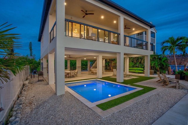 949 24th St, Ocean, Marathon, FL 33050 - rear view of property featuring ceiling fan, a balcony, stucco siding, a fenced backyard, and a patio area