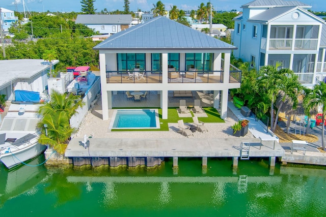 949 24th St, Ocean, Marathon, FL 33050 - back of property with a fenced backyard, a patio, a water view, a sunroom, and a metal roof