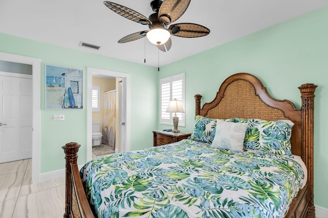 150 10th St, Key Colony, FL 33051 - bedroom featuring baseboards, a ceiling fan, and ensuite bathroom