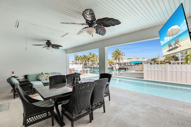 150 10th St, Key Colony, FL 33051 - view of patio / terrace with a ceiling fan, an outdoor pool, an outdoor living space, and outdoor dining area