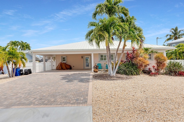 150 10th St, Key Colony, FL 33051 - ranch-style home with decorative driveway and a carport