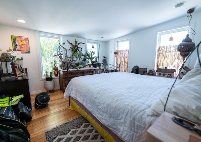 1124 Catherine St Unit 202, Key West, FL 33040 - bedroom with wood finished floors, baseboards, and recessed lighting