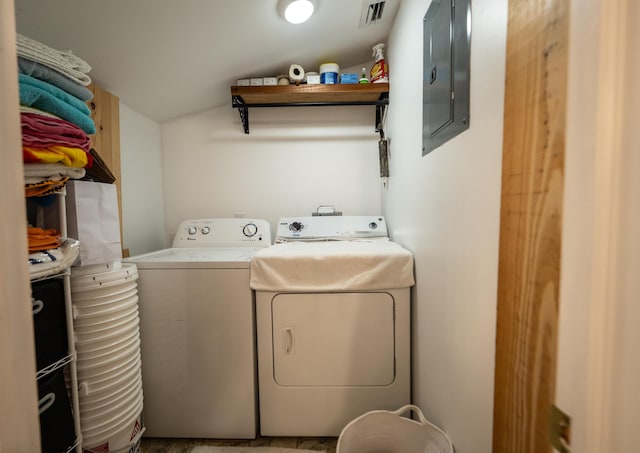 1124 Catherine St Unit 202, Key West, FL 33040 - laundry area with electric panel, washer and clothes dryer, and cabinet space