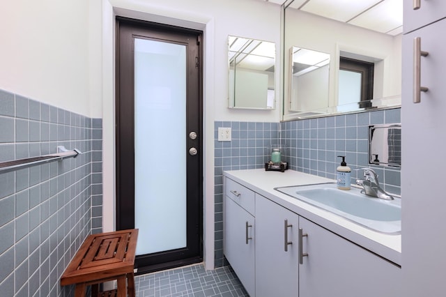 1110 Johnson St, Key West, FL 33040 - bathroom featuring tile walls, vanity, tile patterned flooring, and wainscoting