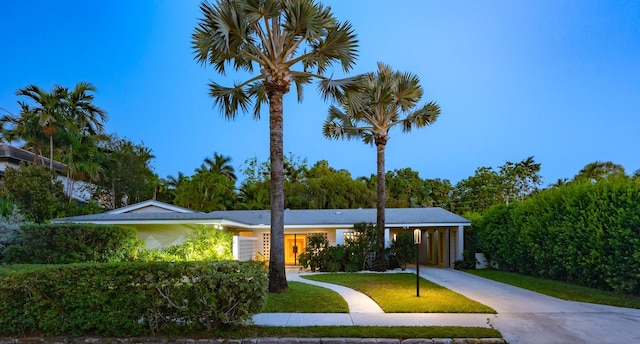 1110 Johnson St, Key West, FL 33040 - ranch-style home with driveway, an attached carport, and a front yard