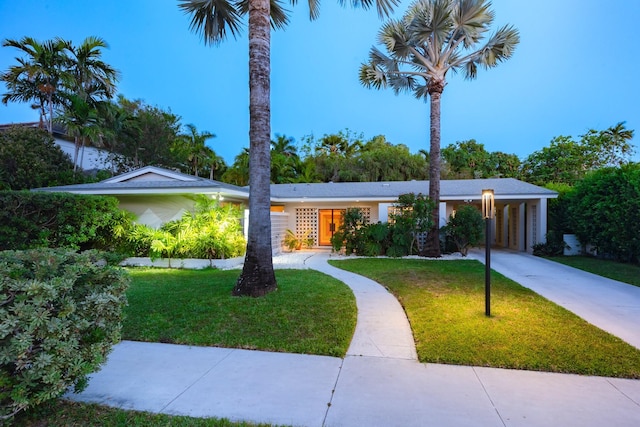 1110 Johnson St, Key West, FL 33040 - ranch-style home with a front yard and driveway