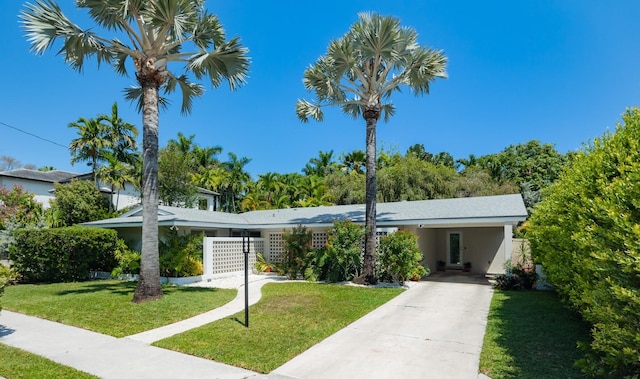 1110 Johnson St, Key West, FL 33040 - view of front of home with driveway, a carport, and stucco siding
