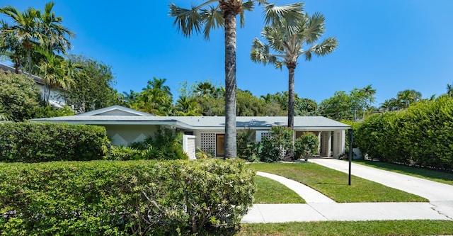 1110 Johnson St, Key West, FL 33040 - view of front of house with a front yard, driveway, and stucco siding