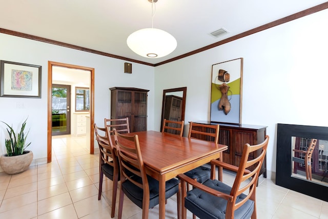 1110 Johnson St, Key West, FL 33040 - dining space with crown molding, light tile patterned flooring, and baseboards