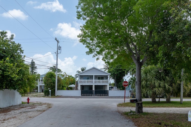 45 1st St, Big Coppitt, FL 33040 - view of front facade with fence and a balcony