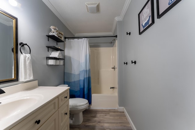 45 1st St, Big Coppitt, FL 33040 - bathroom with visible vents, wood finished floors, vanity, toilet, and ornamental molding