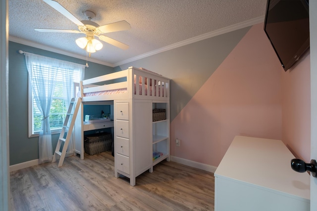 45 1st St, Big Coppitt, FL 33040 - unfurnished bedroom with light wood-type flooring, a textured ceiling, and crown molding