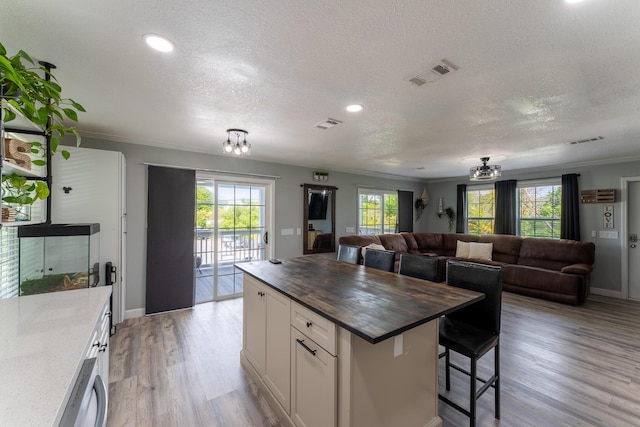 45 1st St, Big Coppitt, FL 33040 - kitchen featuring visible vents, open floor plan, and wood counters