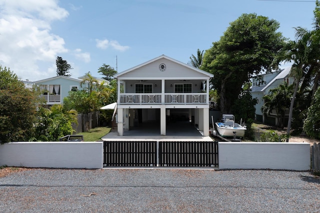 45 1st St, Big Coppitt, FL 33040 - back of house featuring a ceiling fan, a fenced front yard, and a balcony