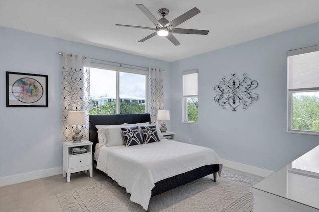 tiled bedroom with ceiling fan