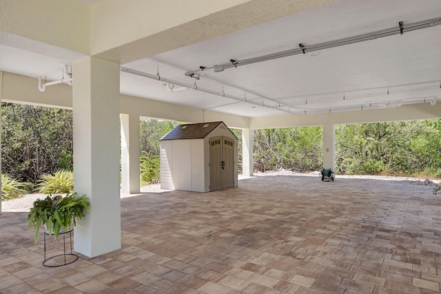 view of patio featuring a shed