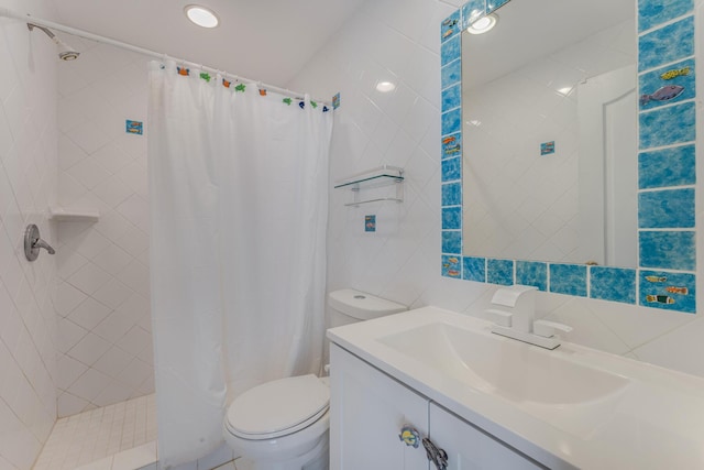 bathroom with toilet, vanity, tile walls, tiled shower, and tasteful backsplash