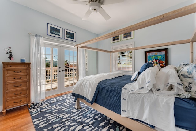 bedroom featuring light wood-type flooring, access to outside, french doors, and a ceiling fan