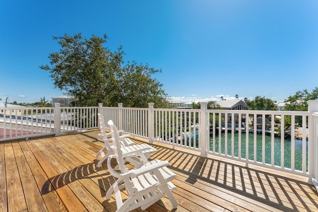 deck featuring a water view