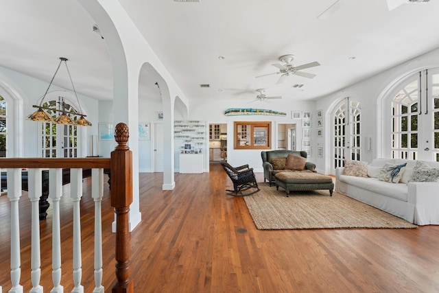 living area with wood finished floors and french doors