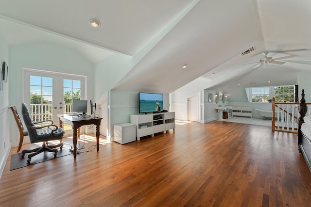 living area featuring wood finished floors, an upstairs landing, visible vents, vaulted ceiling, and french doors