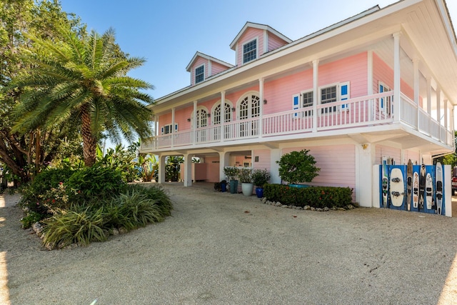 view of front of house with driveway and a carport