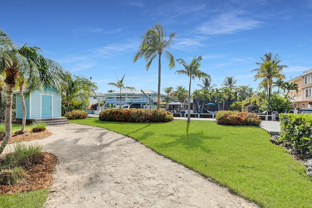 1514 Shaw Dr, Key Largo, FL 33037 - view of community featuring a yard, dirt driveway, and an outdoor structure