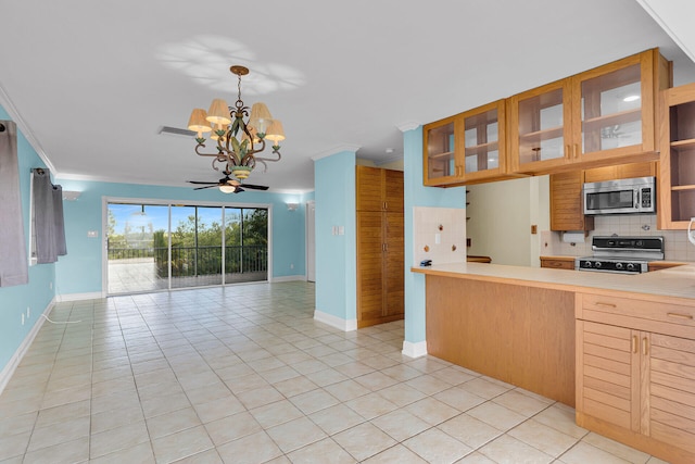 1514 Shaw Dr, Key Largo, FL 33037 - kitchen featuring stainless steel microwave, stove, open floor plan, a chandelier, and tasteful backsplash