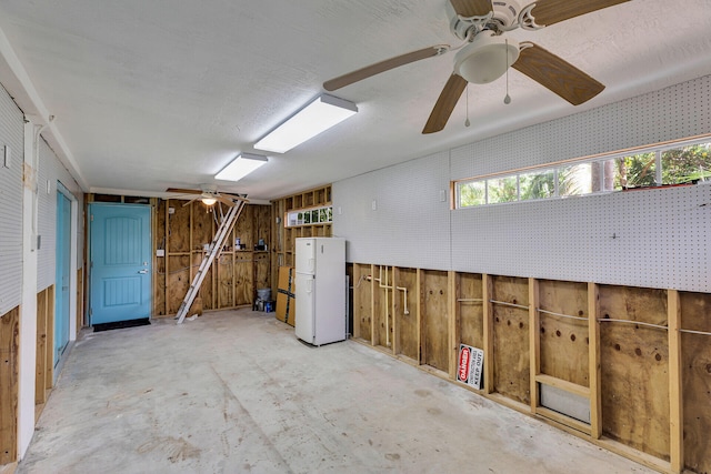 1514 Shaw Dr, Key Largo, FL 33037 - below grade area featuring freestanding refrigerator, ceiling fan, and wooden walls